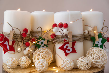 Four Advent candles calendar with Christmas zero waste decorations. Holiday preparation copy space for text. Catholic traditions of Christmas countdown new year winterの写真素材