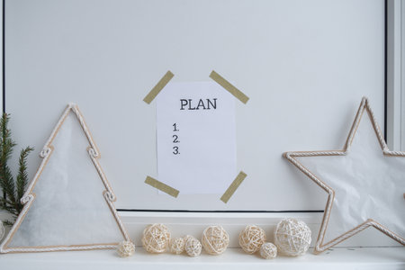 Paper note with inspirational to do checklist PLAN with natural zero waste homemade Christmas decor. Happy new year promises resolutions. Self growth and personal developmentの写真素材