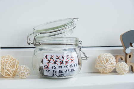 Step by step instruction of making handmade Christmas advent sweet candies calendar. Female hands creating craft homemade decor. New year celebrationの写真素材