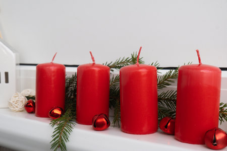Traditional four advent weeks before Christmas holidays. Red candles and plastic free decoration. Copy space greeting card mock up template. Winter cozyの写真素材