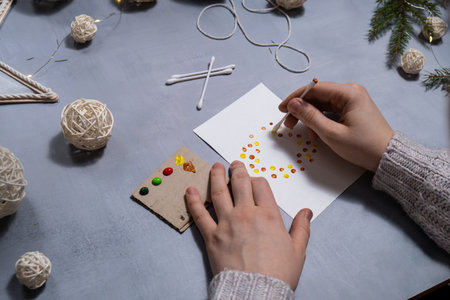 Christmas wreath Sustainable Christmas preparation Diy process of making handmade greeting cards. Step by step activity for children. Inclusive and responsible stress relief holiday hobby. Conscious celebrationの写真素材