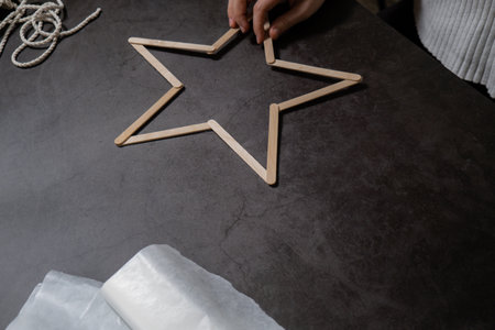Ice cream sticks Christmas star Sustainable preparation Diy process making handmade decoration. Step...