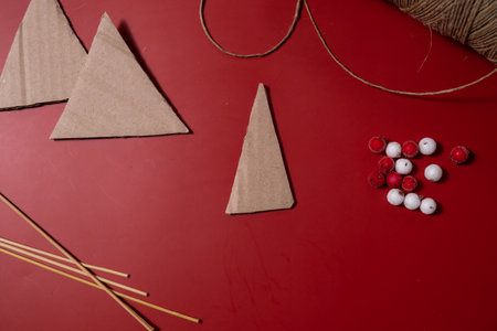 Rope Christmas trees Storytelling creating craft Christmas holiday present. Tactile hand-on activity. Master class progress of creative me-made gifts. Seasonal domestic life micro moment hobby. Sustainable livingの写真素材
