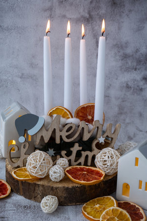 Four Advent candles calendar with Christmas zero waste decorations. Holiday preparation copy space for text. Catholic traditions of Christmas countdown new year winter holidaysの写真素材
