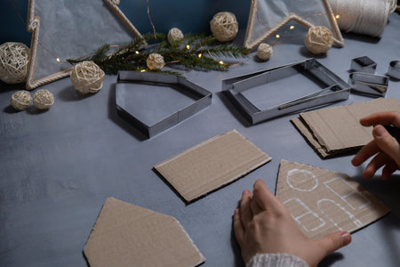 Cardboard House Gift Christmas idea. Do it yourself instructions eco-friendly decoration. Zero waste Making handmade presents children's diy projects. Holiday family time. Creative activityの写真素材