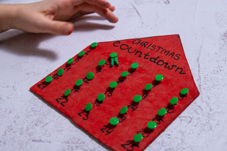 Wooden Christmas advent house calendar handmade Storytelling creating craft Christmas holiday decoration. Tactile hand-on activity. Master class progress of creative me-made gifts. Seasonal domestic life micro moment hobbyの写真素材