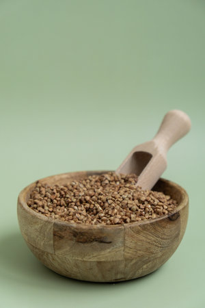 Raw buckwheat porridge Gluten free cereals. Health gut benefits. Concept of alternative whole spelt grain ingredient. Vegetarian diet recipes. Plant-based lifestyle. Copy space Protein richの写真素材