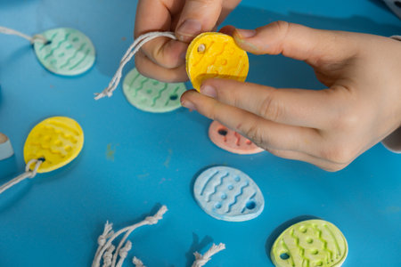 Children air dry clay activity handicraft idea. DIY process step by step instruction. Preparing for Easter holiday decorating. Modern organic design minimalistic plastic free sustainableの写真素材