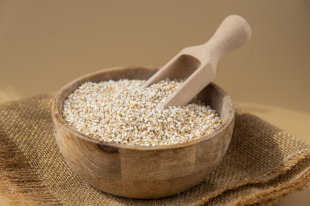 Raw fine ground barley porridge. Health gut benefits. Concept of alternative whole spelt grain ingredient. Vegetarian diet recipes. Plant-based lifestyle. Copy spaceの写真素材