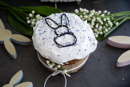 Homemade traditional Easter cake pastry bakery. Festive spring table setting decoration with fresh...