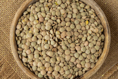 Raw green lentil Gluten free cereals. Health gut benefits. Concept of alternative whole spelt grain...