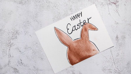 EASTER bunny painting Sustainable preparation Diy process of making handmade greeting cards. Step by step activity for children. Inclusive and responsible stress relief holiday hobbyの写真素材