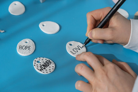 Master class writing word LOVE on EASTER egg Children air dry clay activity handicraft idea. DIY process step by step instruction. Preparing for Easter holiday decorating. Modern organic design minimalistic plastic free sustainableの写真素材