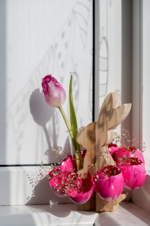 Creative vibrant handmade Easter table decoration with egg shells wooden bunny copy space. Greeting card idea Easter home tradition Seasonal sustainableの写真素材