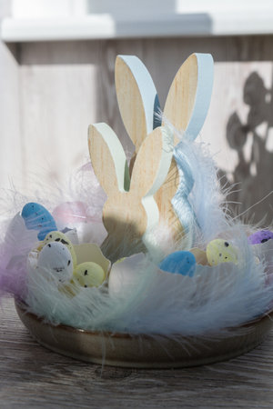 Unrecognizable woman creating Easter holiday decoration from sustainable materials egg shell. Diy do...