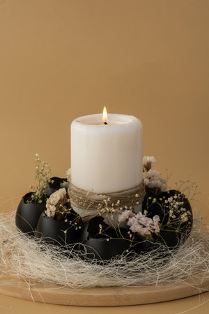 Self made egg shell with candle handmade decoration for Easter holiday. Copy space greeting card present gift ideas. Creative reuse zero waste sustainable living eco-friendly me made decor. Minimalistic idea repurposed materialsの写真素材