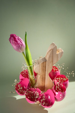 Easter holiday decoration from sustainable materials pink colored egg shell wooden bunny vase decor with fresh tulip flower. Copy space Diy do it yourself Gift present idea. Zero waste Crafting preparationの写真素材