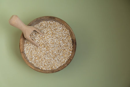 Raw fine ground barley porridge Gluten free cereals. Health gut benefits. Concept of alternative whole spelt grain ingredient. Vegetarian diet recipes. Plant-based lifestyle. Copy space Protein richの写真素材