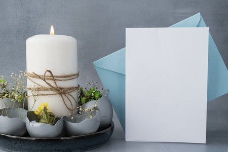 Envelope mockup template Self made egg shell with candle handmade decoration for Easter holiday. Copy space greeting card present gift ideas. Creative reuse zero waste sustainable living eco-friendly me made decor. Minimalistic idea repurposed materialsの写真素材