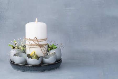 Easter holiday decoration from sustainable materials egg shell decor with candle. Copy space Diy do it yourself Gift present idea. Zero waste Crafting preparationの写真素材