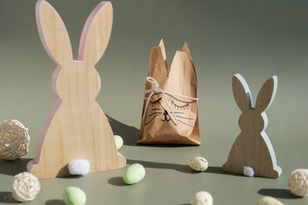 Homemade Easter gift bag rabbit bunny shaped sustainable materials decorations from craft paper. Creative craft handmade present for children. Easter celebration ideasの写真素材