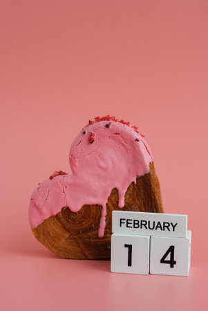 14 February calendar date Delicious fresh croissant topped with colorful flavor Ganache. Creation...