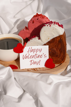 HAPPY VALENTINES DAY phrase lettering paper greeting card Morning breakfast in bed in wooden tray Present gift idea Holiday celebration Heart shaped croissants. Puff pastry new trendy sweet dessert bakery. Creamy doughの写真素材