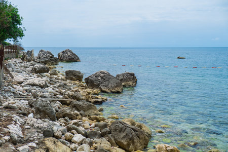 Beautiful rocks and bright turquoise water among layered rocks near Budva, Montenegro. Tropical summer landscape exotic beach on the Adriatic Sea. Vacationの写真素材