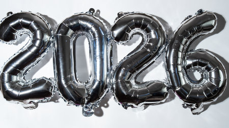 Happy new year 2026 metallic balloons on white background. Greeting card silver foil balloons numbers Christmas holiday concept. Celebration party congratulationの写真素材