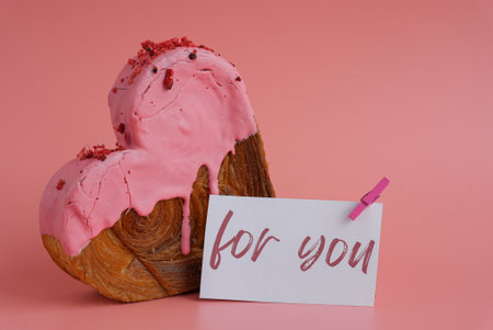 FOR YOU saying caption on greeting card Delightful heartshaped pastry croissant treat, beautifully topped with colorful frosting galore. Copy space. Food experimentation viral dessert creative baking trendの写真素材
