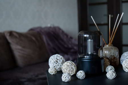 Home fragrance aromatic diffuser with essential oil. Modern air humidifier at home. Improving the...