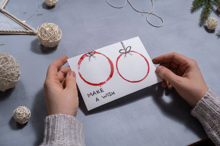 Christmas balls Storytelling of creating craft Christmas greeting card holiday present. Tactile hand-on activity. Master class progress of creative me-made gifts. Seasonal domestic life micro moment hobby.の写真素材