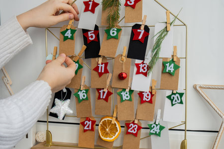 Traditional twenty four days advent calendar before Christmas holidays. Plastic free zero waste sustainable decoration. Winter cozy home Catholic traditions of Christmas countdown new yearの写真素材