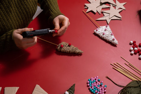 Rope Christmas trees Storytelling creating craft Christmas holiday present. Tactile hand-on activity. Master class progress of creative me-made gifts. Seasonal domestic life micro moment hobbyの写真素材