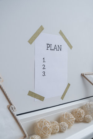 Paper note with inspirational to do checklist PLAN with natural zero waste homemade decor. Happy new year promises resolutions. Self growth and personal developmentの写真素材