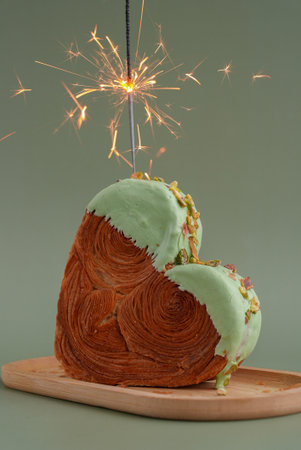 Delicious fresh croissant topped with Matcha Green Tea flavor Ganache. Creation unique heart shape...