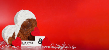 Calendar date 8 march Womens day greeting card Delicious fresh croissant topped with colorful flavor Ganache. Creation unique heart shape bakery. Puff pastry holiday love gift present ideaの写真素材