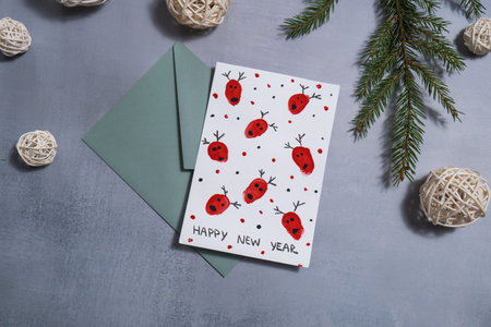 Reindeer fingerprints Sustainable Christmas preparation handmade greeting cards with envelope. Inclusive and responsible holidayの写真素材
