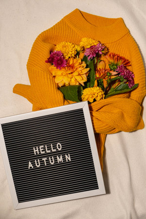 Saying HELLO AUTUMN Selective focus Bush of autumnal orange red chrysanthemums and violet dahlia hydrangea. Fall garden beautiful flowers bouquet background. Blooming blossom thanksgiving day arrangement basketの写真素材