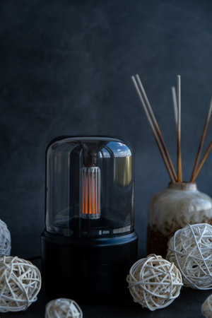 Indoors Decoration with modern lighted Air Humidification Aroma essential oil perfume fragrance. Scented home wellness wellbeing habit. Concept of feeling good spiritual healthの写真素材