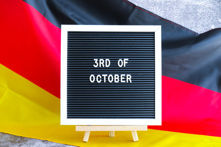 Letter board with message 3rd OF OCTOBER Unity day National symbol of Germany. German wave silky...