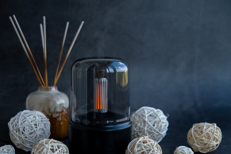 Home fragrance aromatic diffuser with essential oil. Modern air humidifier at home. Improving the...