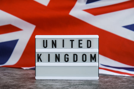 Minimal patriotic scene with signboard and waving flagの写真素材