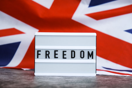 FREEDOM patriotic scene with signboard and waving flagの写真素材