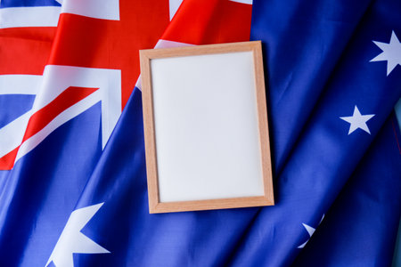 White empty paper copy space template mock up Australian flag background. National symbol and patriotism concept, ideal mock-up for custom copy designs. Place your logo or text on the white paper boardの写真素材