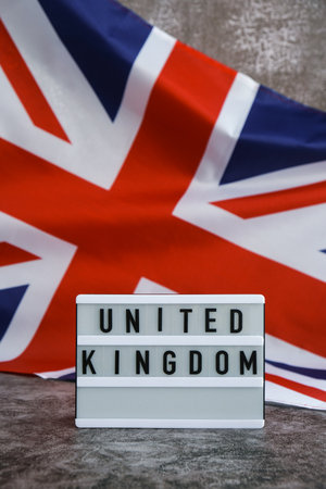 Minimal patriotic scene with signboard and waving flagの写真素材