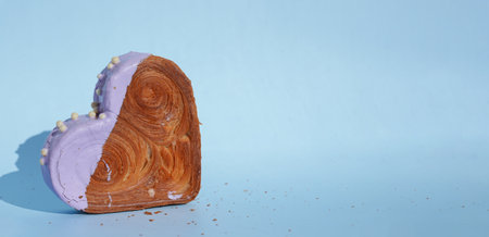 Valentines Day Birthday holiday present gift idea Coffee cappuccino latte beverage drink Morning breakfast Holiday birthday anniversary shiny candle sparkler on cake Delightful and vibrant heartshaped pastry croissant treat, beautifully topped with colorful frosting galore. Food experimentation dessert creative baking trendの写真素材