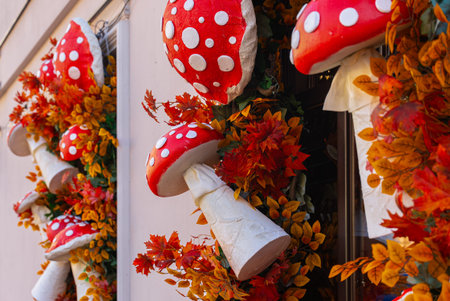 Decorative Autumn Fly Agaric Mushrooms Adorning Building Facade and Windows