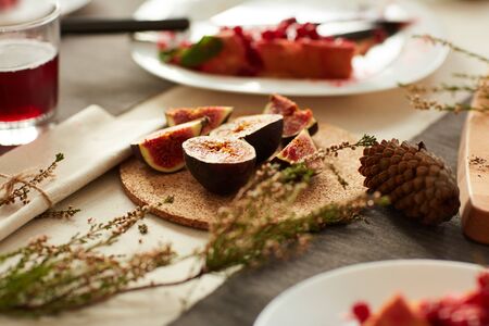 Close-up of fresh exotic slices of fruits on dinner table