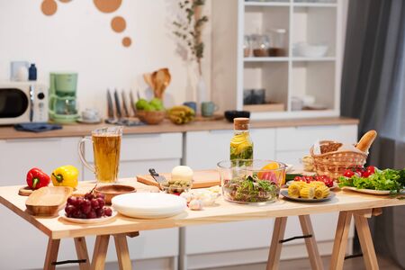 Image of table with food and drinks on it served for holiday in the kitchen at homeの写真素材
